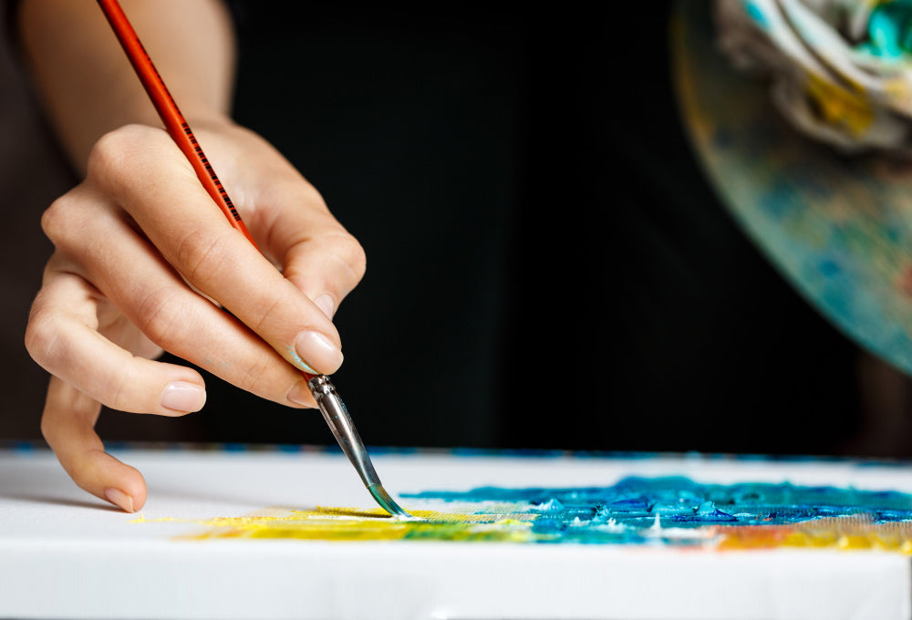 Painting On Canvas By Numbers A Woman Is Holding A Brush And