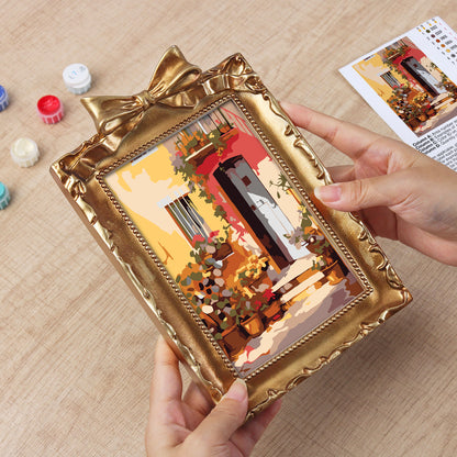 Framed mini paint by numbers showing a Mediterranean passage filled with vibrant flowers and decorative details