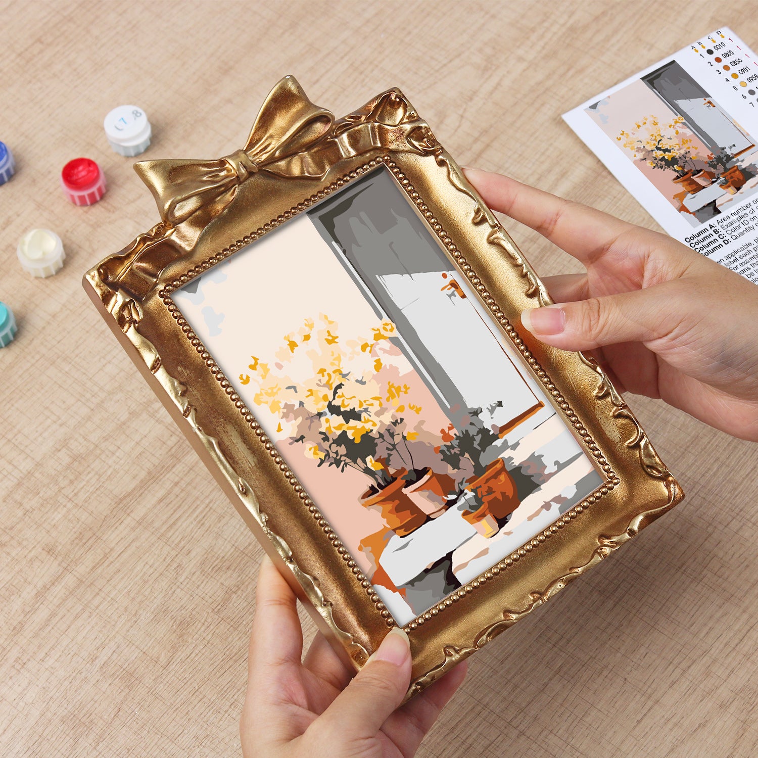 Framed mini paint by numbers of a sunlit indoor plant corner with greenery and natural light