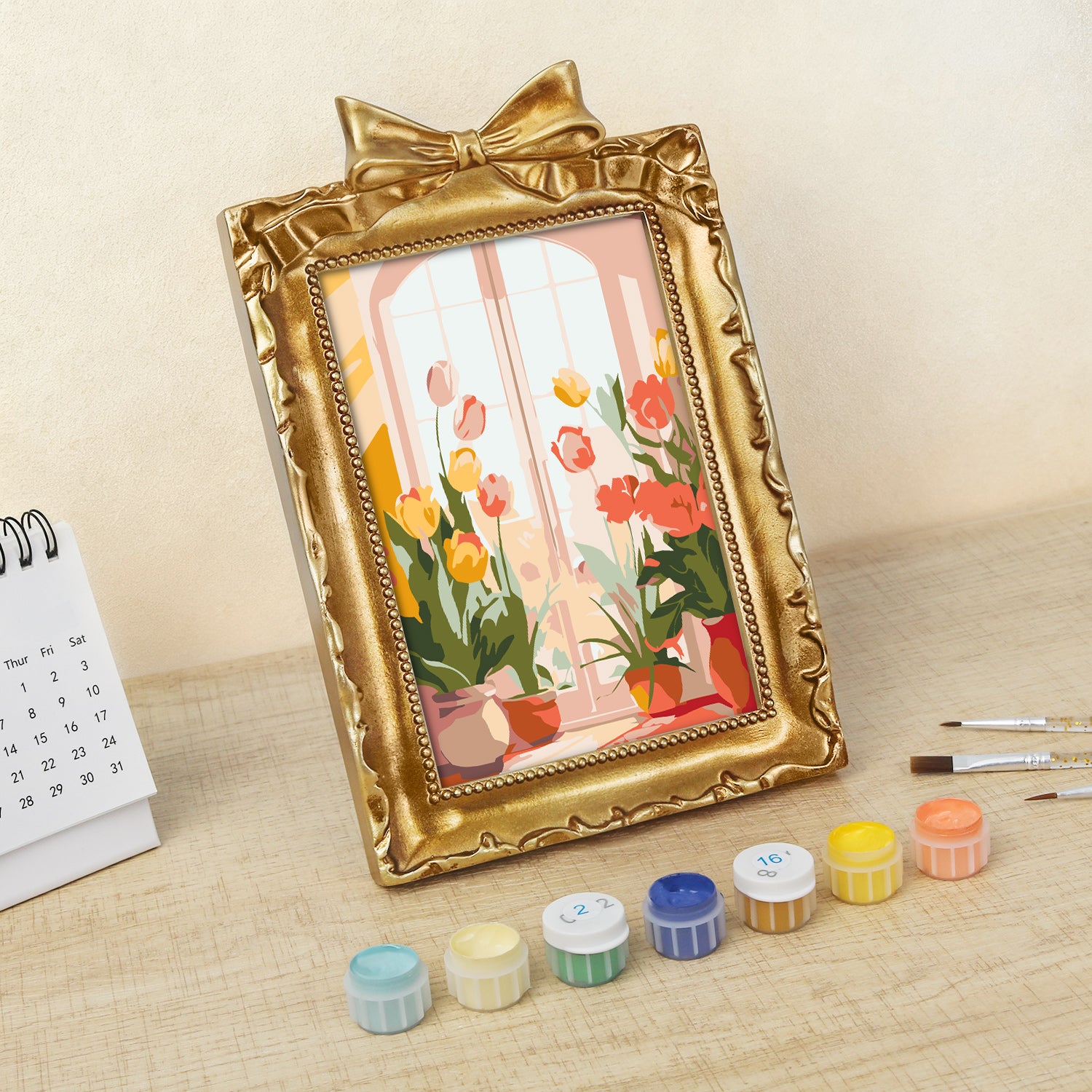 Framed mini paint by numbers of a cozy window filled with blooming flowers and warm decorative details