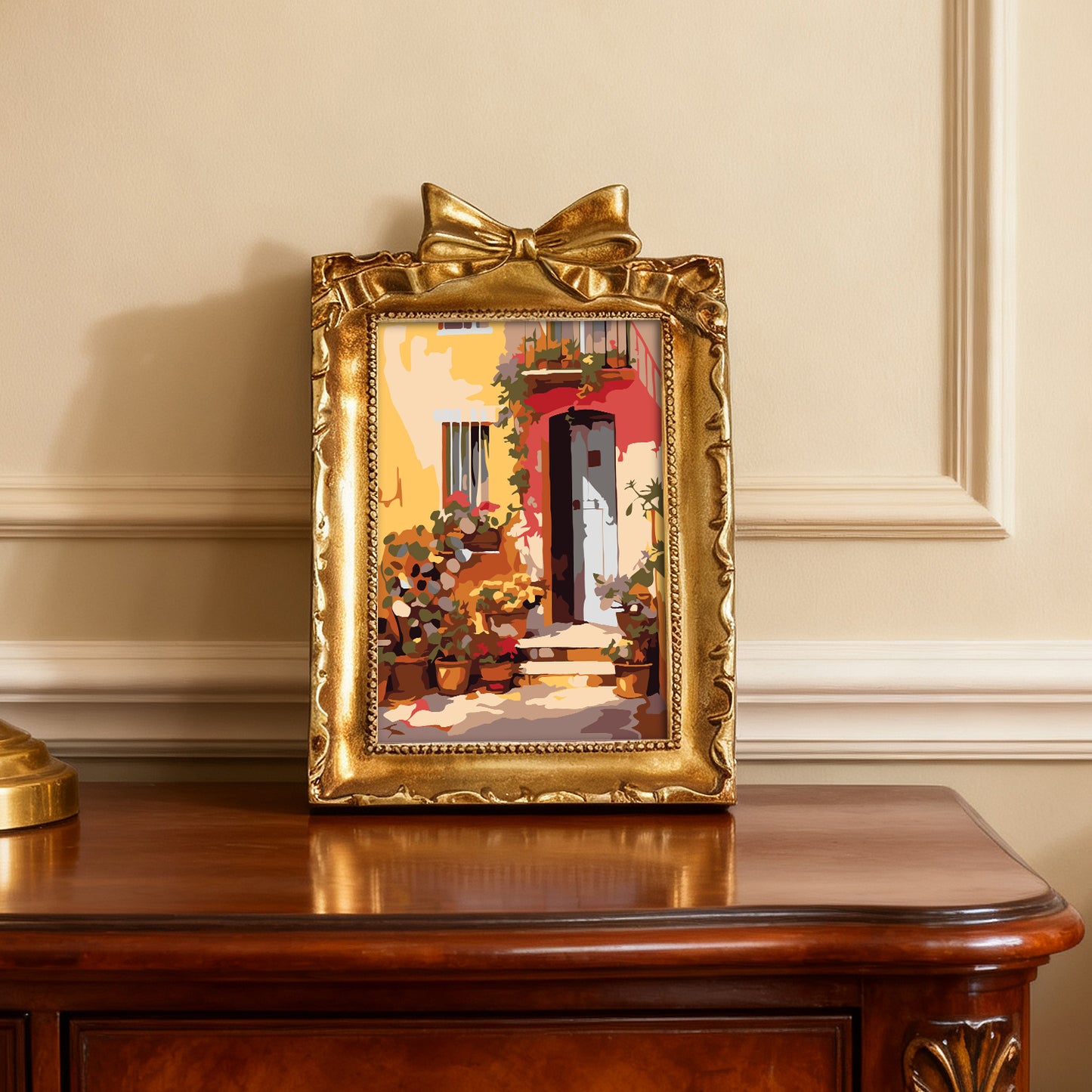 Framed mini paint by numbers showing a Mediterranean passage filled with vibrant flowers and decorative details