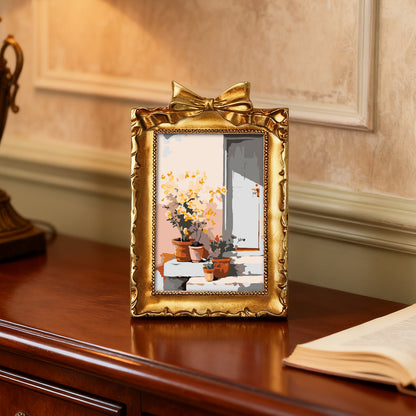 Framed mini paint by numbers of a sunlit indoor plant corner with greenery and natural light