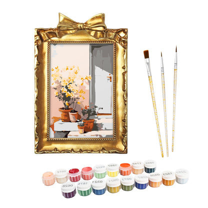 Framed mini paint by numbers of a sunlit indoor plant corner with greenery and natural light