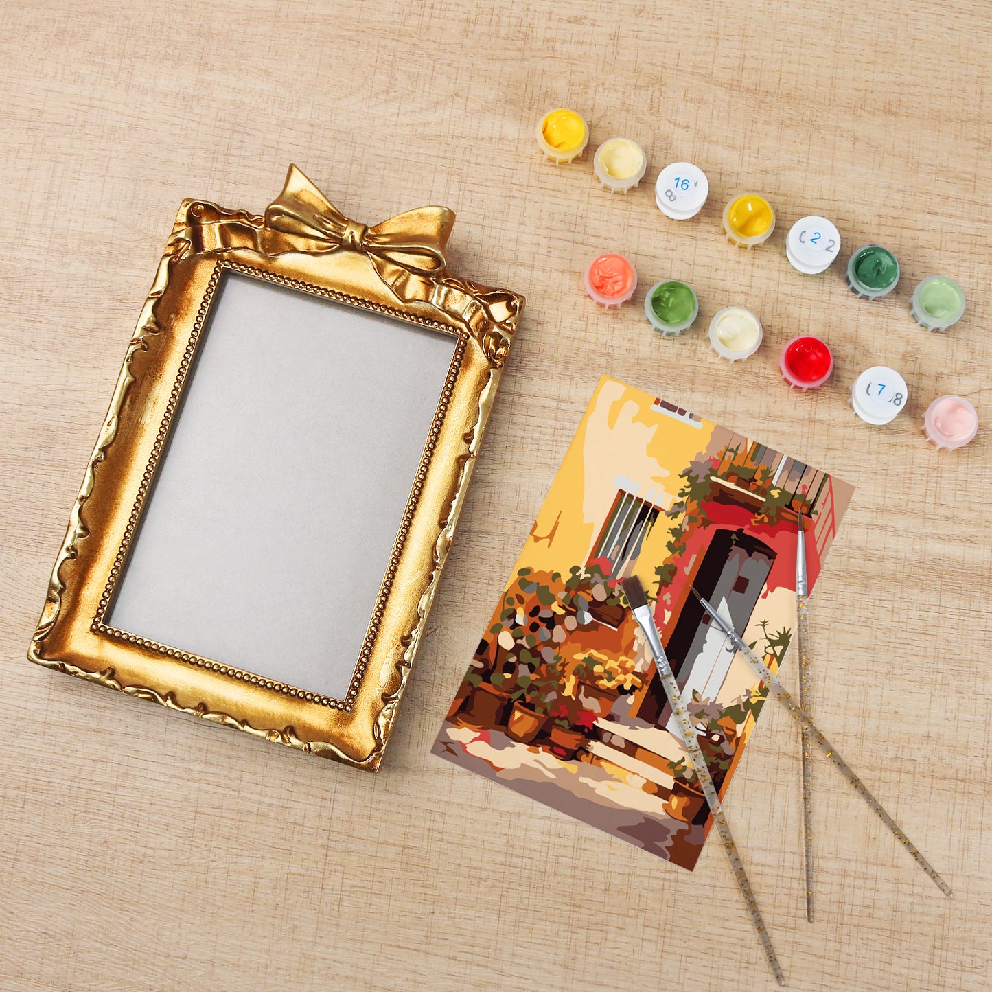 Framed mini paint by numbers showing a Mediterranean passage filled with vibrant flowers and decorative details