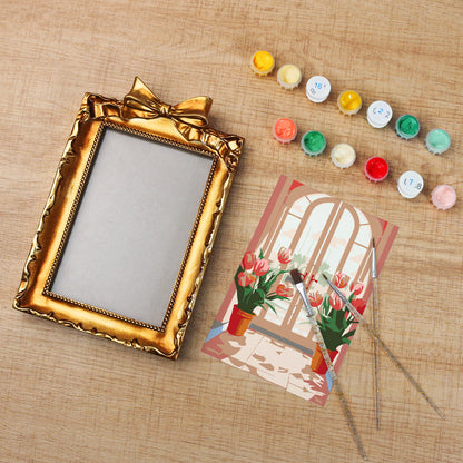Framed mini paint by numbers featuring a window garden filled with colorful tulips and bright floral accents