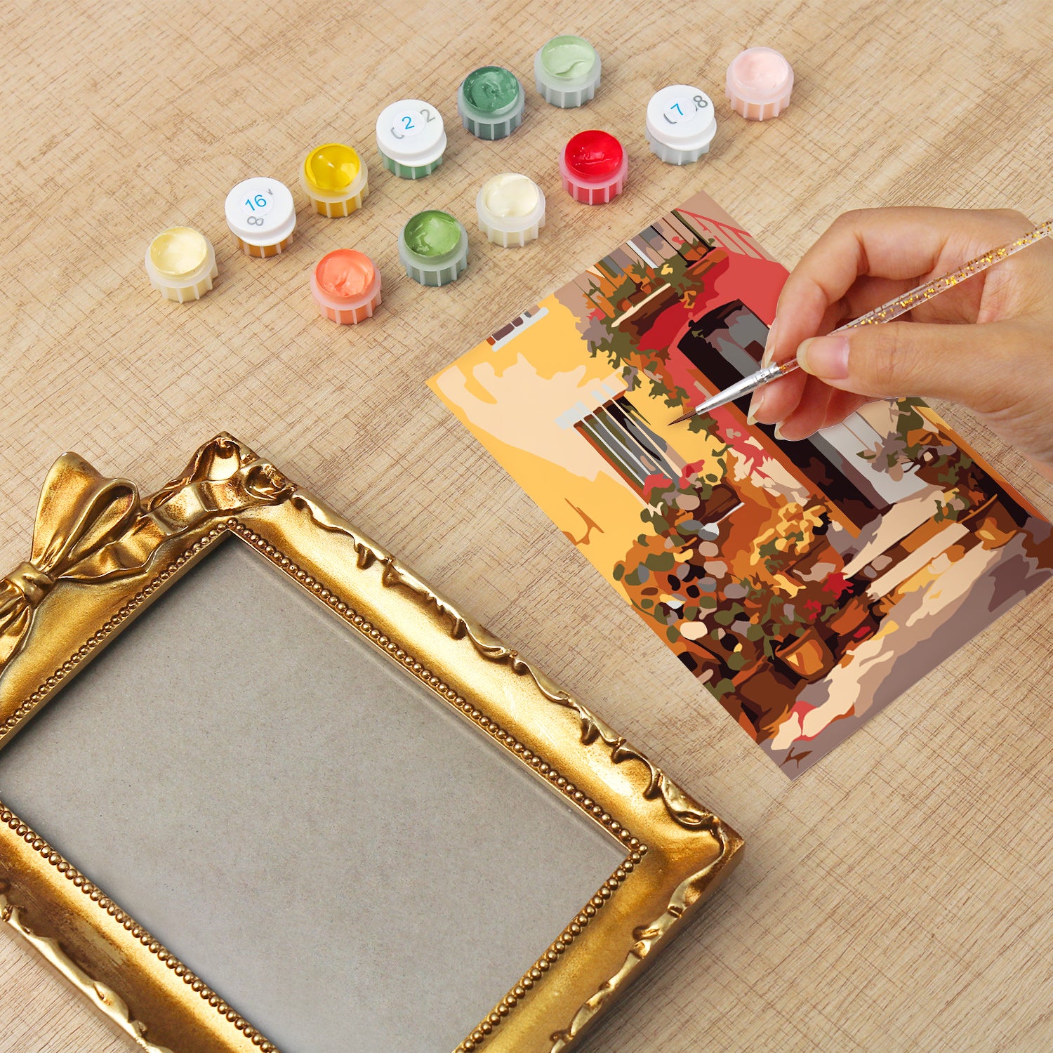 Framed mini paint by numbers showing a Mediterranean passage filled with vibrant flowers and decorative details