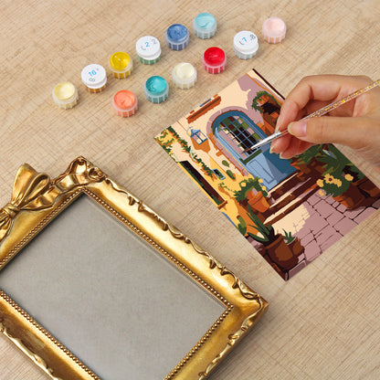 Framed mini paint by numbers of a charming garden door surrounded by lush flowers and greenery