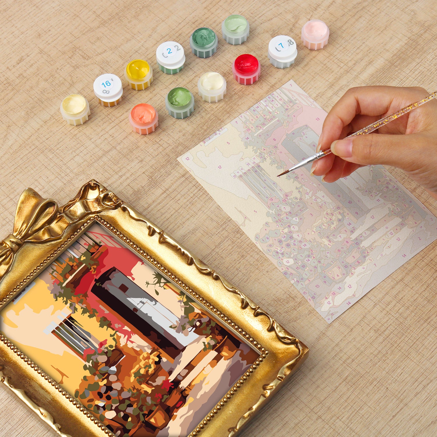 Framed mini paint by numbers showing a Mediterranean passage filled with vibrant flowers and decorative details