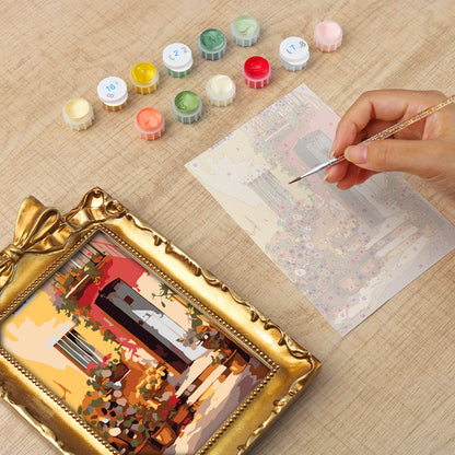 Framed mini paint by numbers showing a Mediterranean passage filled with vibrant flowers and decorative details