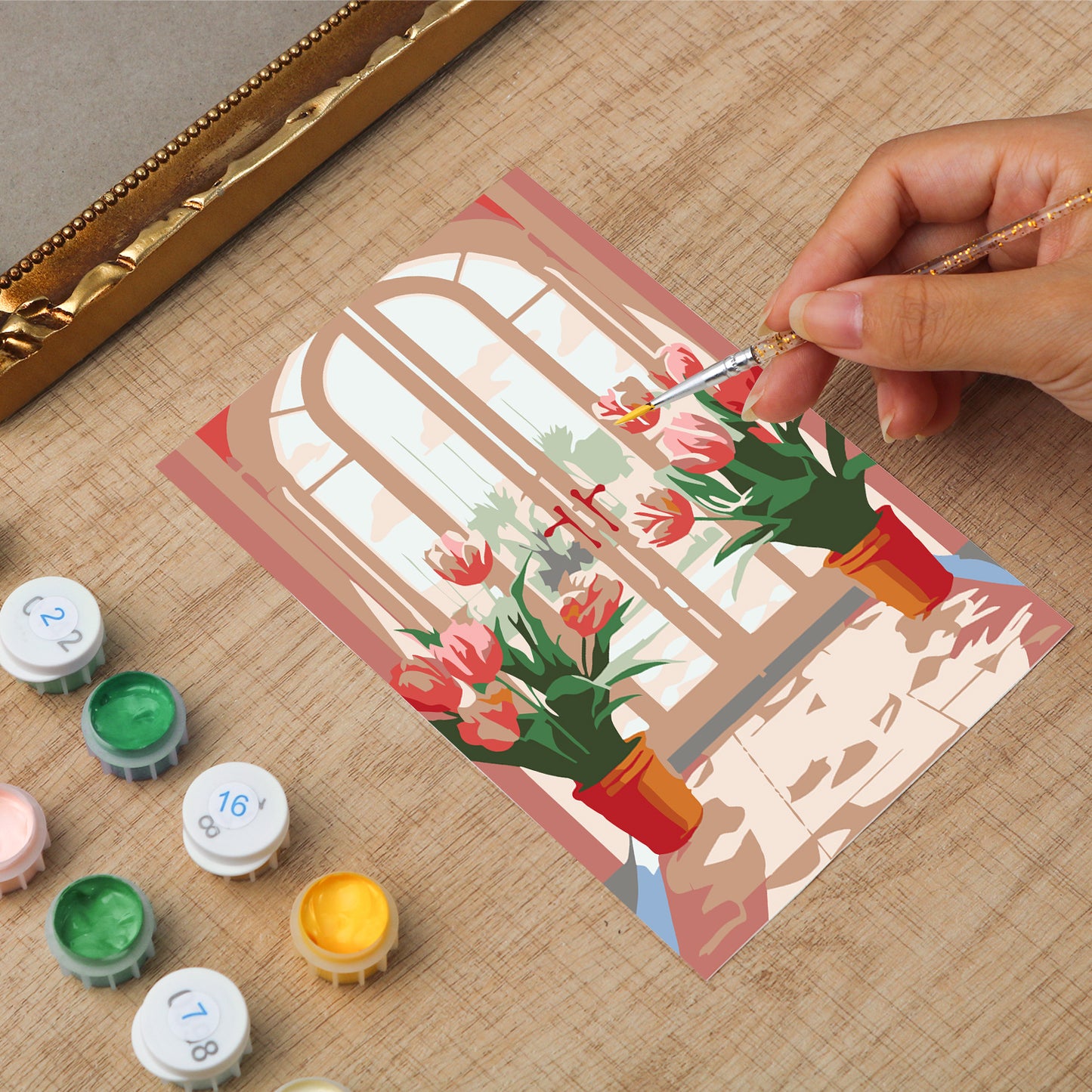 Framed mini paint by numbers featuring a window garden filled with colorful tulips and bright floral accents