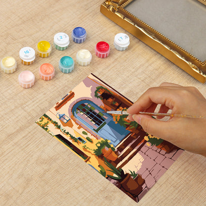 Framed mini paint by numbers of a charming garden door surrounded by lush flowers and greenery