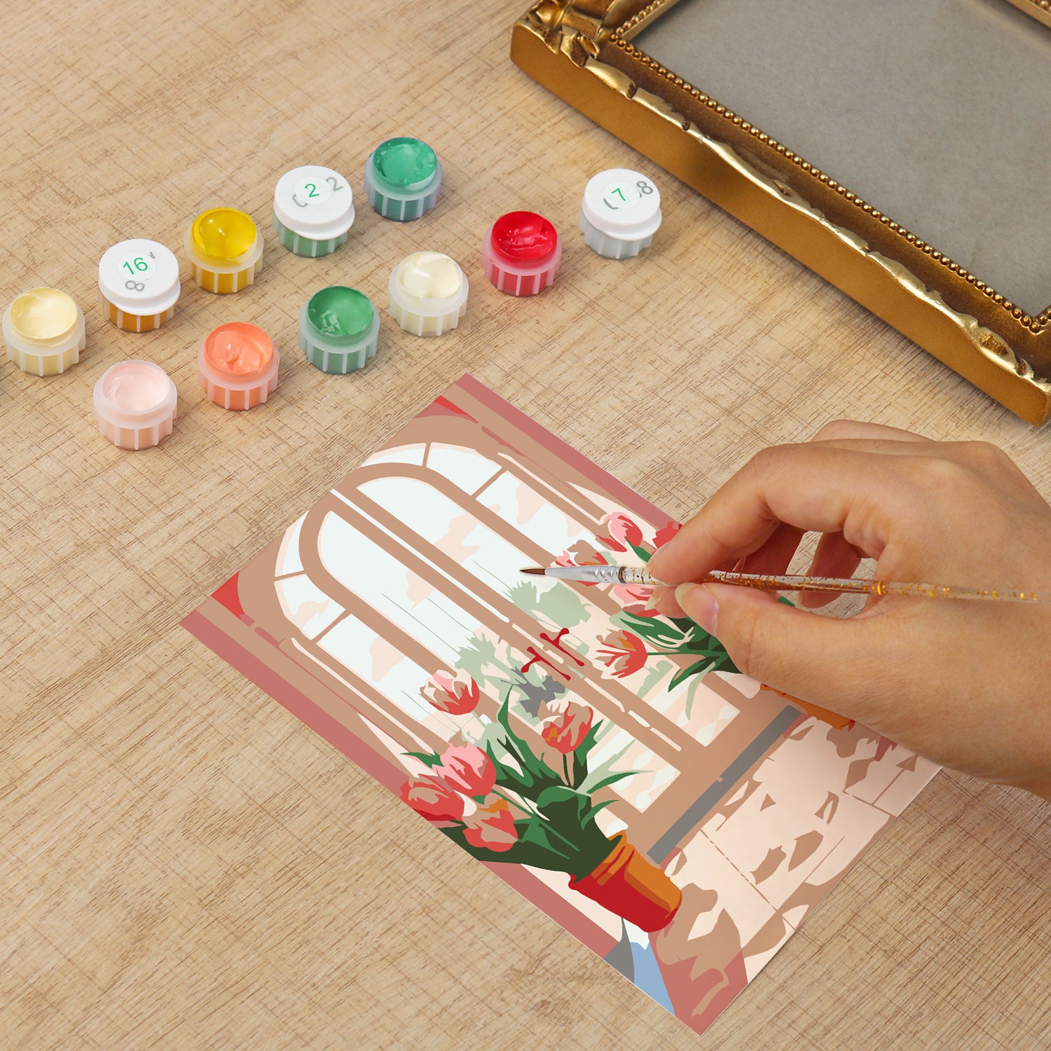 Framed mini paint by numbers featuring a window garden filled with colorful tulips and bright floral accents