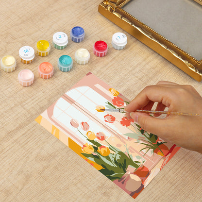 Framed mini paint by numbers of a cozy window filled with blooming flowers and warm decorative details