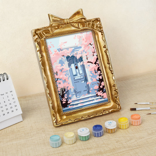 Kyoto Cherry Blossoms framed mini paint by numbers featuring sakuras over a blue doorway