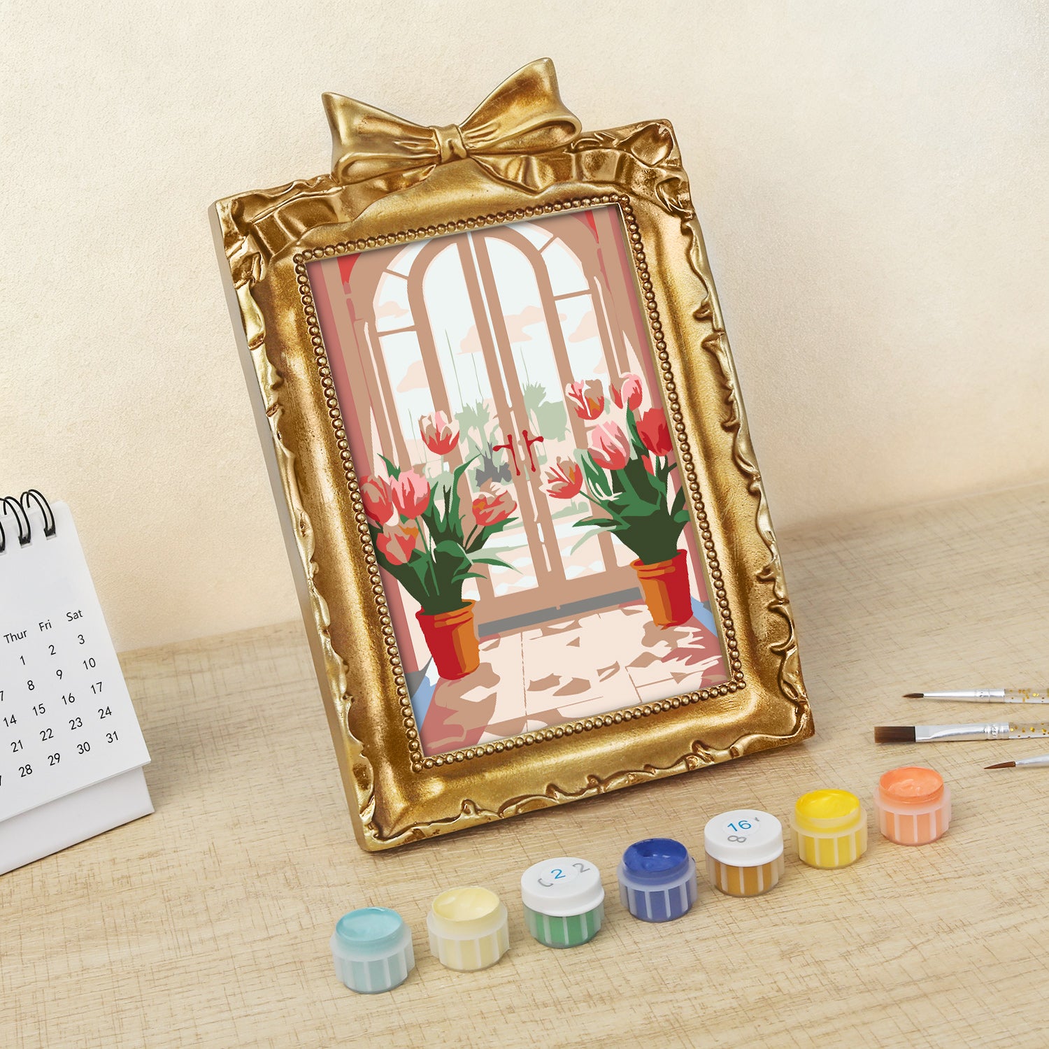 Framed mini paint by numbers featuring a window garden filled with colorful tulips and bright floral accents